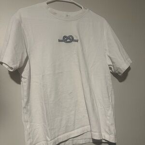 Zara white graphic shirt with blue ribbon front and Capbreton Print back.